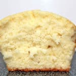 vanilla cupcake cut in half showing its fluffy texture