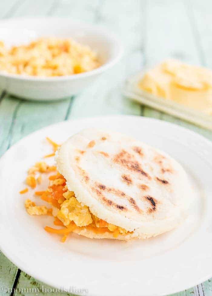 Learn How to Make Venezuelan Arepas and open a world of delicious food possibilities for your family!! These flat patty made of maize flour are sooo yummy and so easy to make. Fill them with chicken salad, tuna, pulled pork, beef, cheese, ham, eggs... the possibilities are endless. https://mommyshomecooking.com