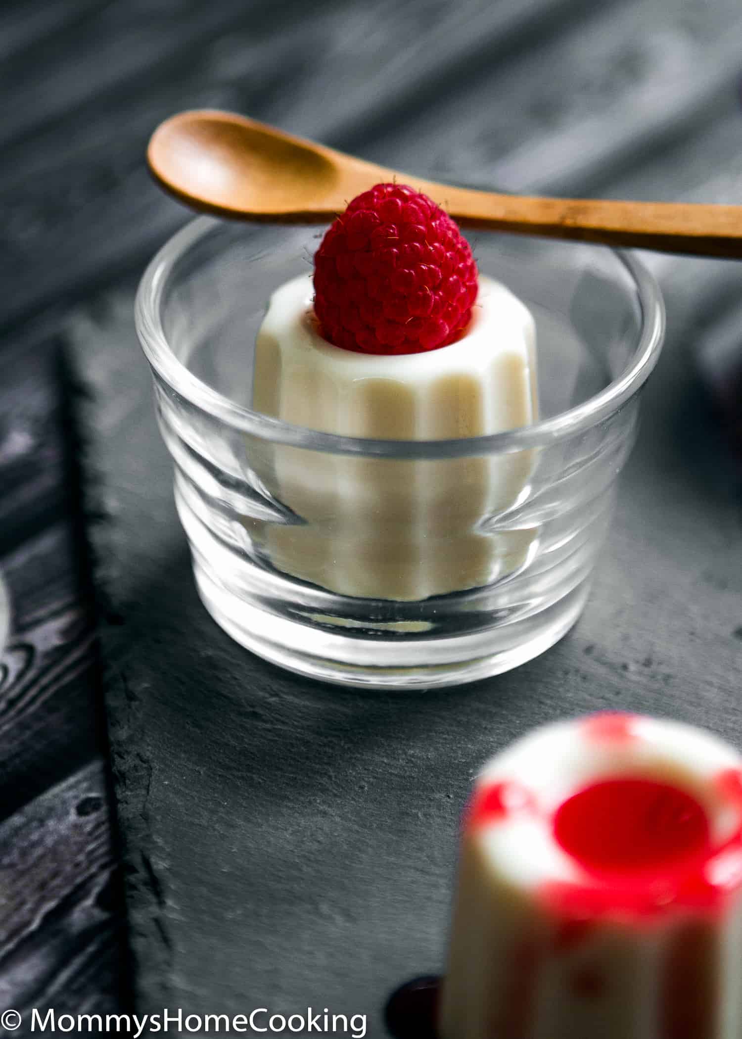 This Panna Cotta with Raspberry Coulis recipe is creamy, rich and silky! This amazingly creamy, melting in the mouth dessert is super easy to make with just 5 ingredients. https://mommyshomecooking.com