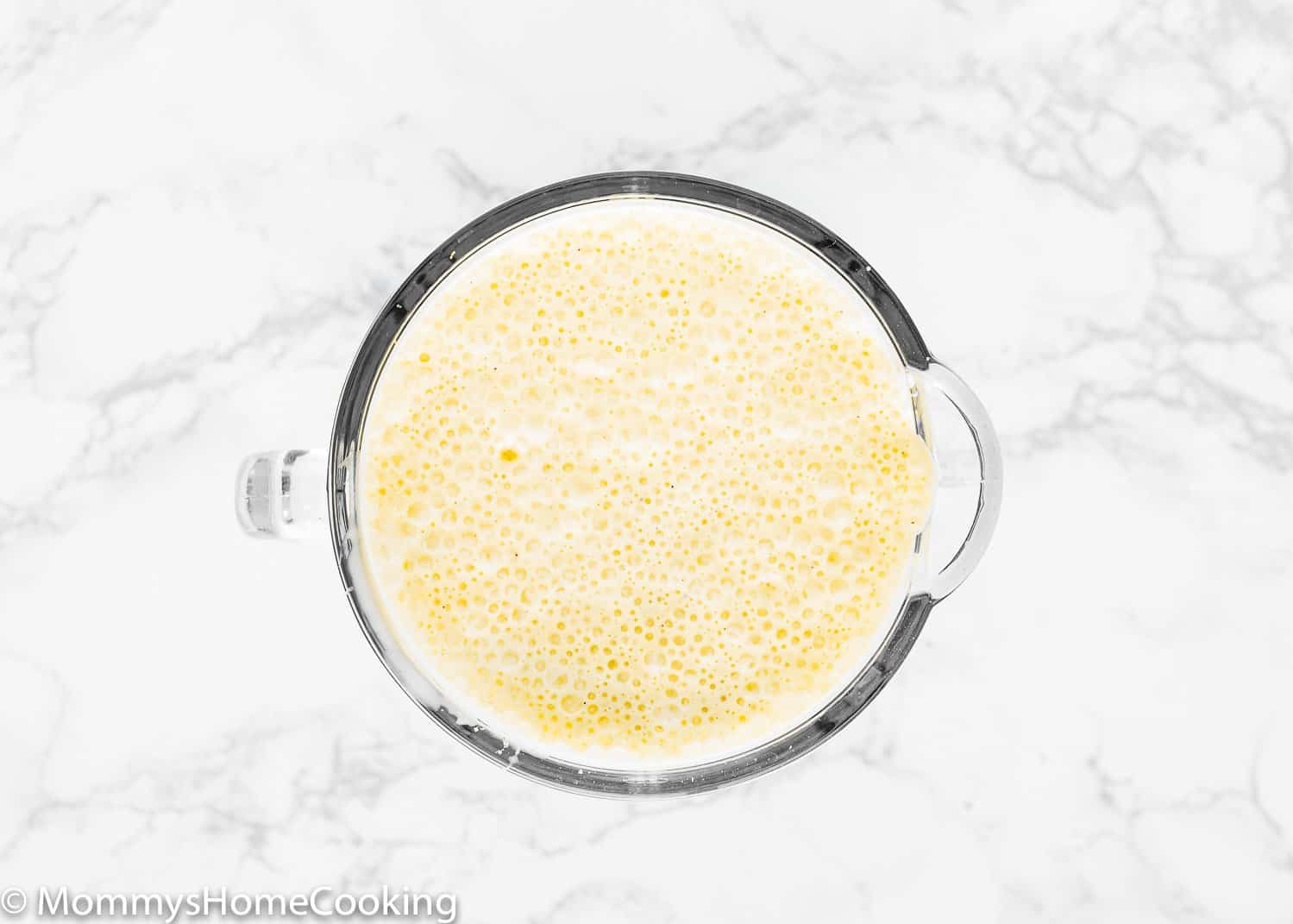 ponche crema ingredients in a blender.