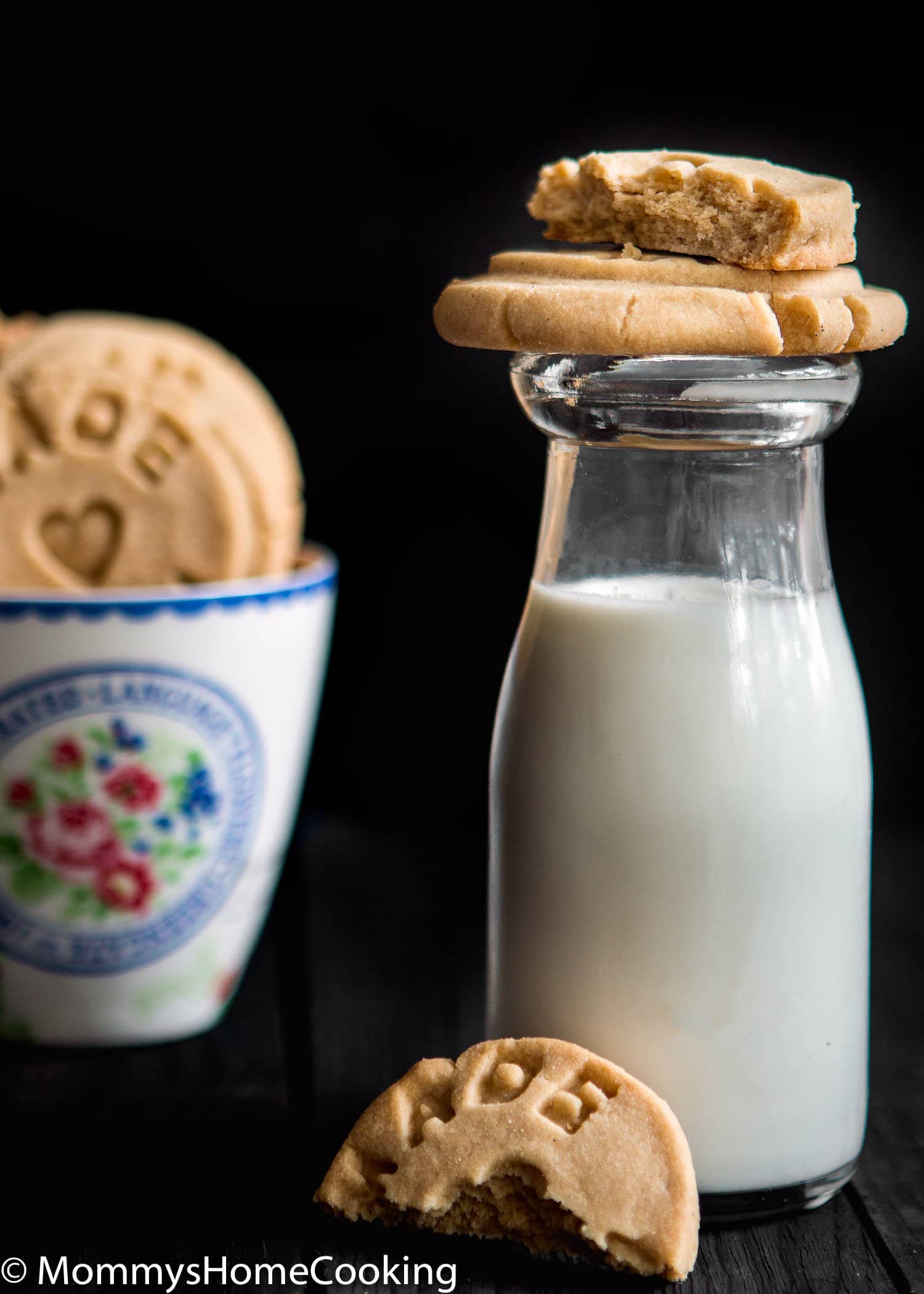 Easy Eggless Vanilla Cookies over a jar with milk.