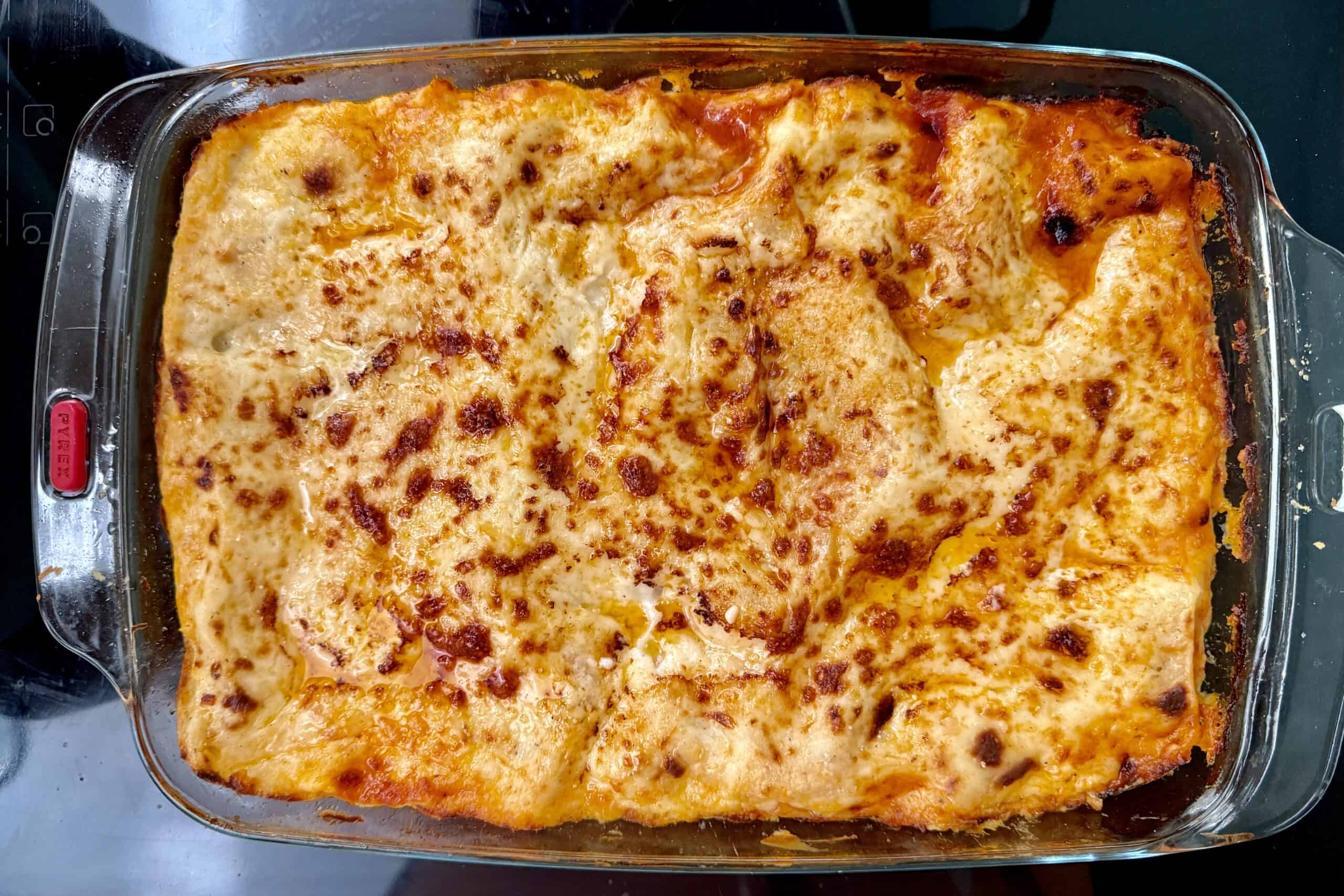 Baked Venezuelan Pasticho in a glass baking dish.