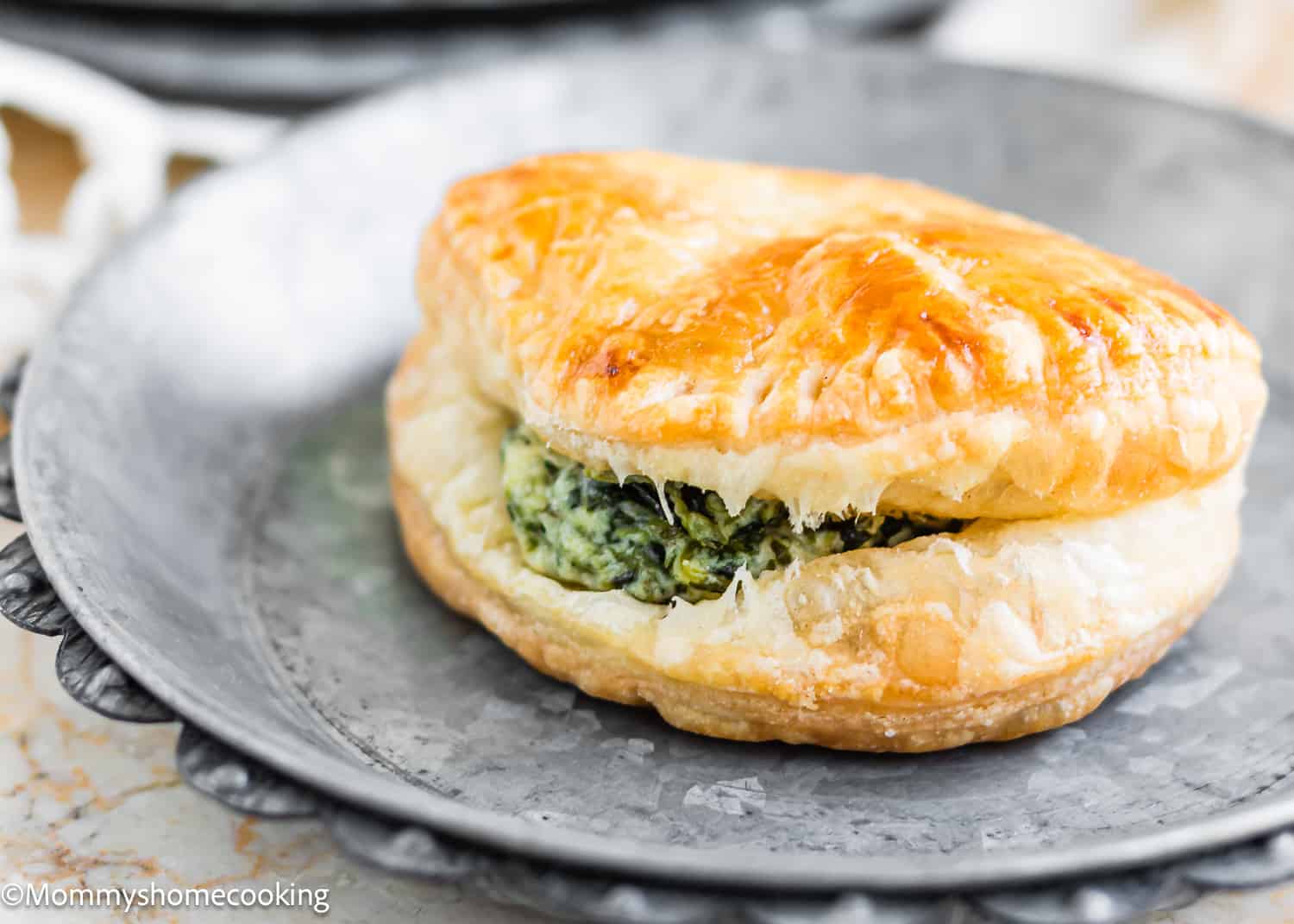 Spinach and Cheese Hand Pie on a plate.