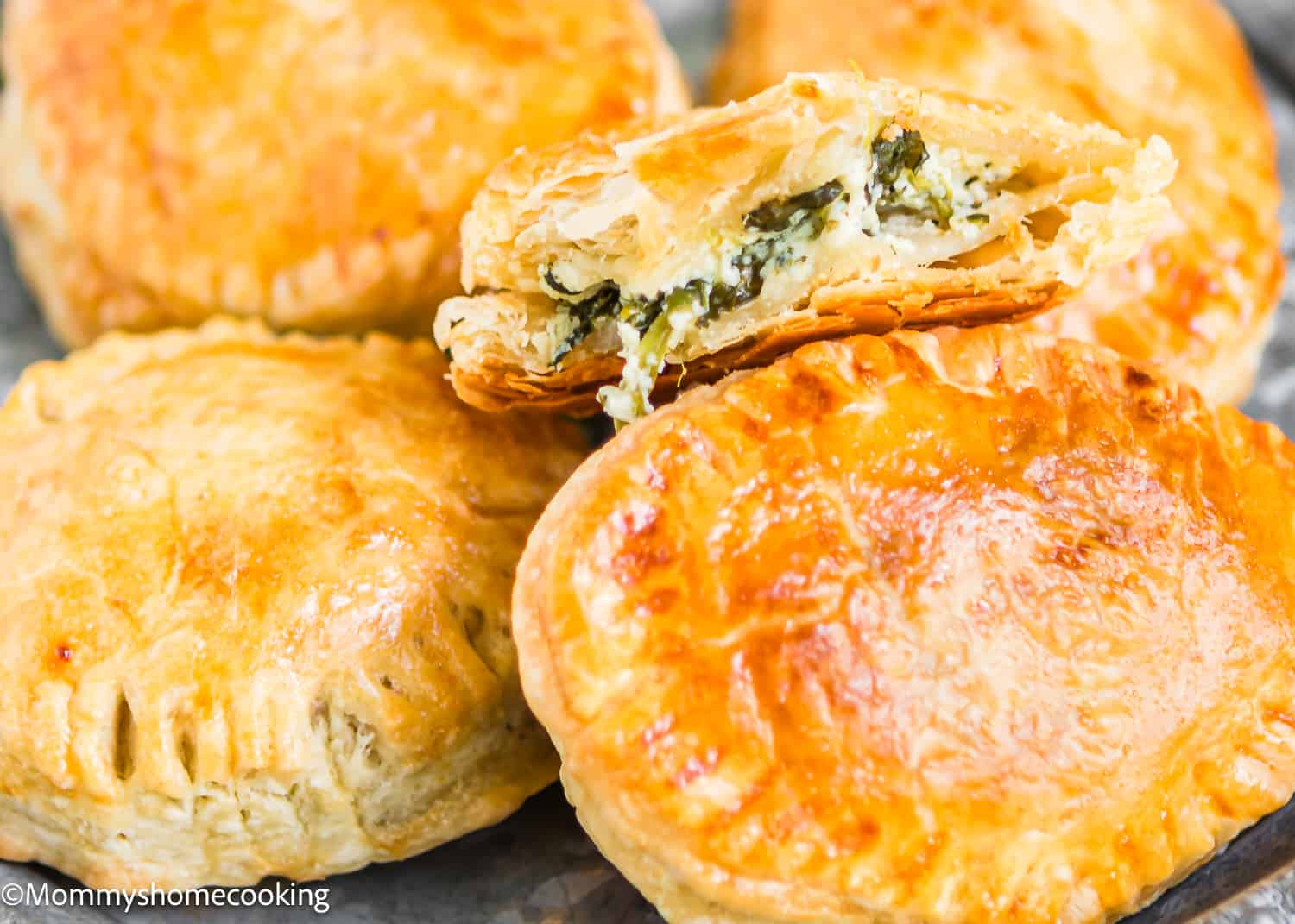 Spinach and Cheese Hand Pies on a plates.