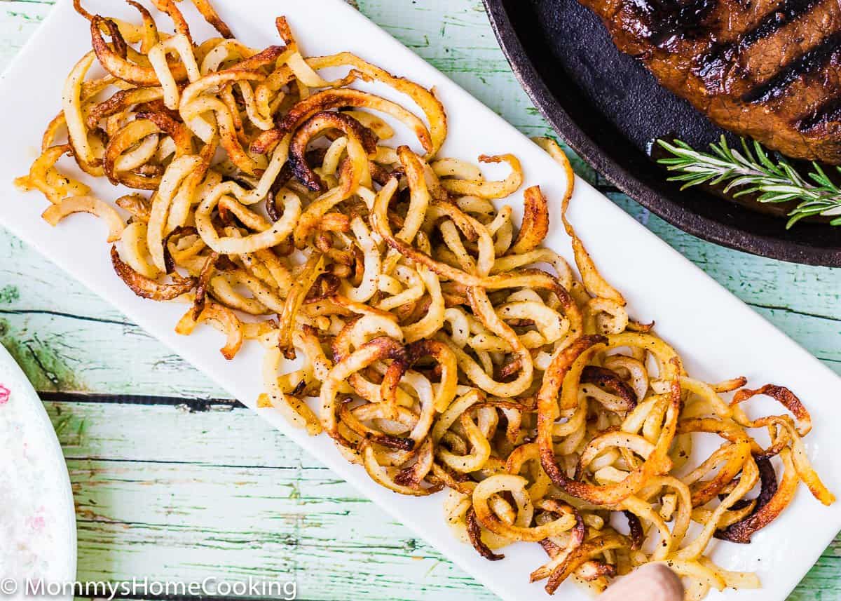 homemade curly fries on a plate