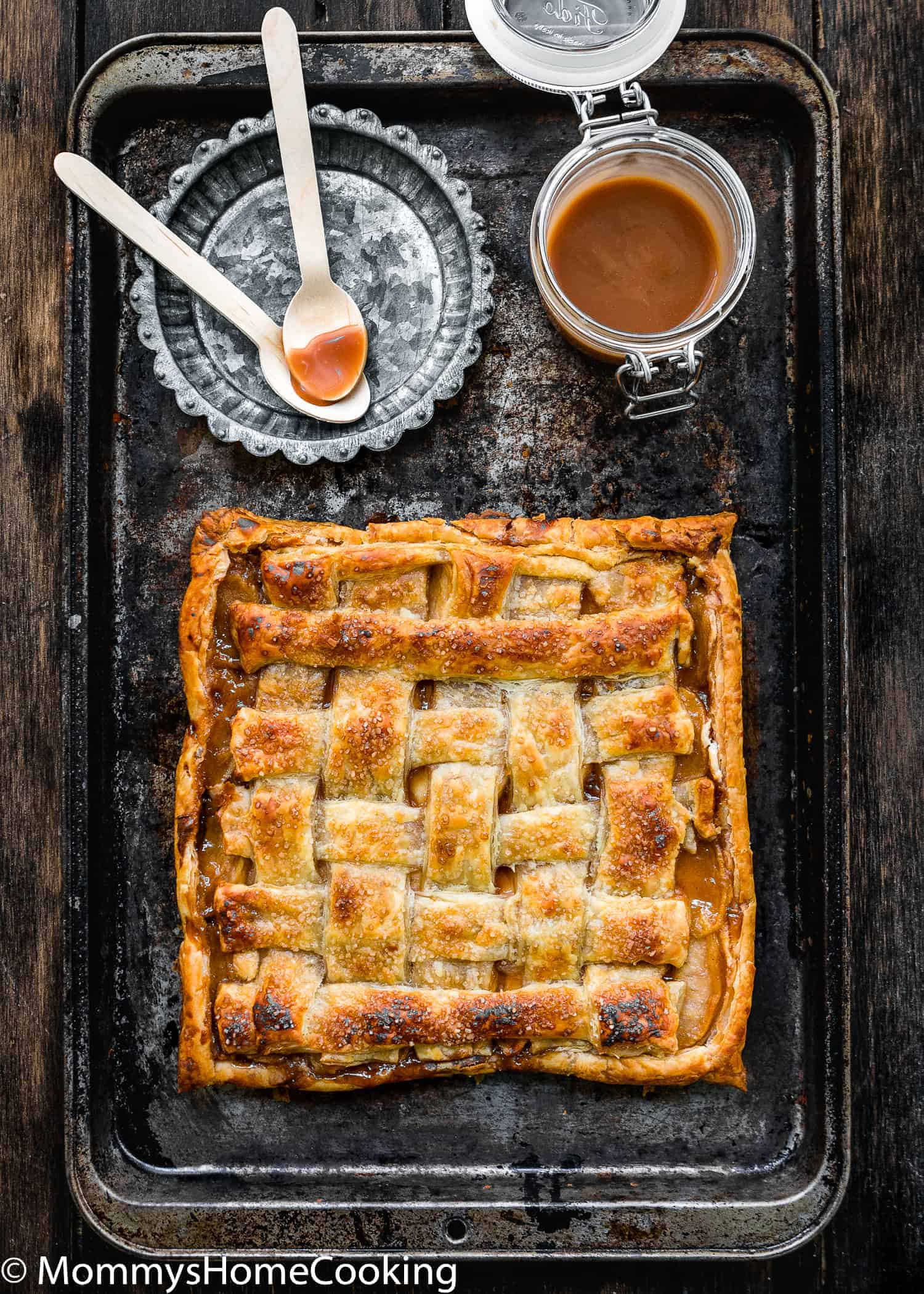 Eggless Salted Caramel Apple Cheese Danish in a baking sheet with caramel sauce