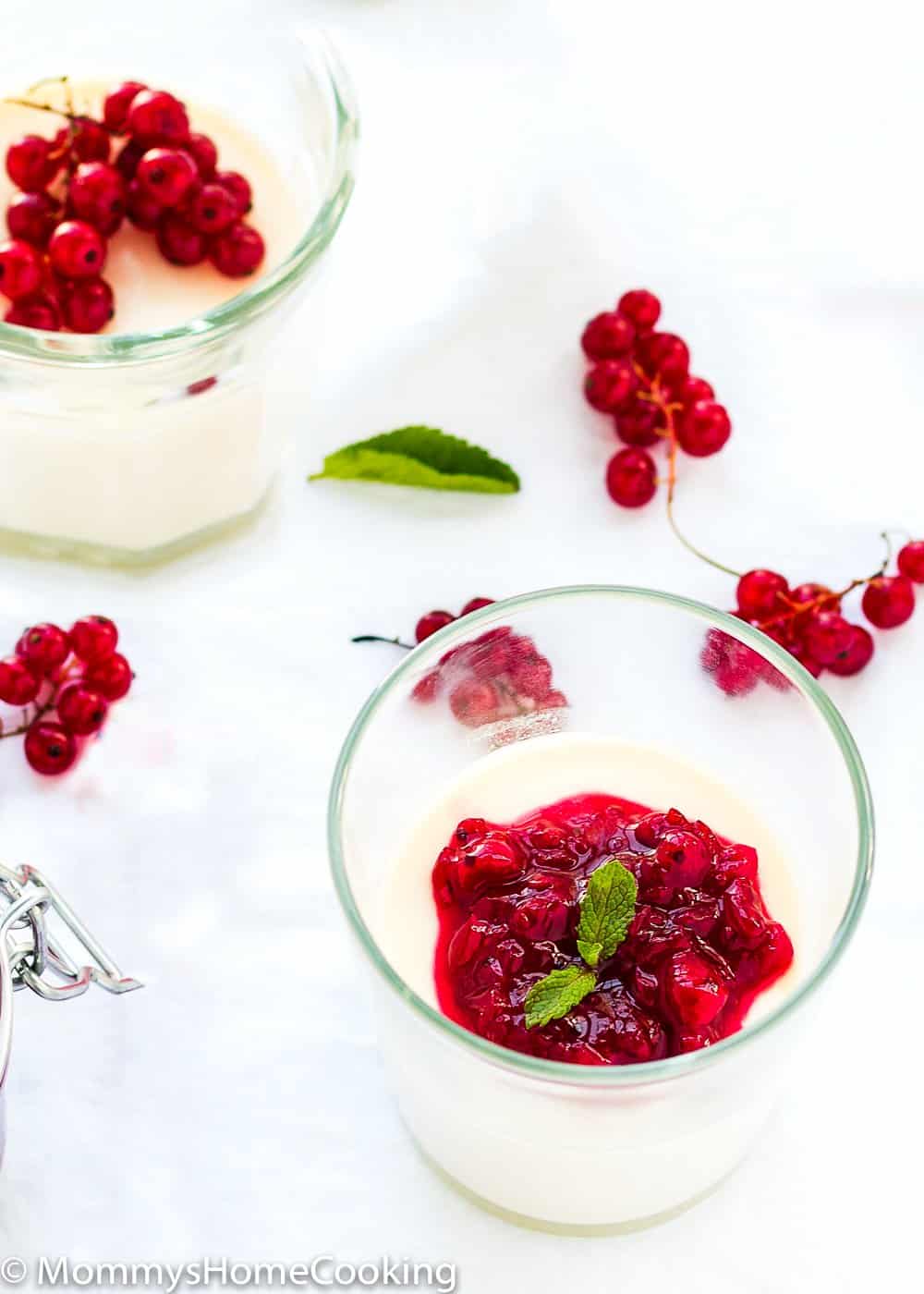 White Chocolate Panna Cotta in a glass with red currant sauce