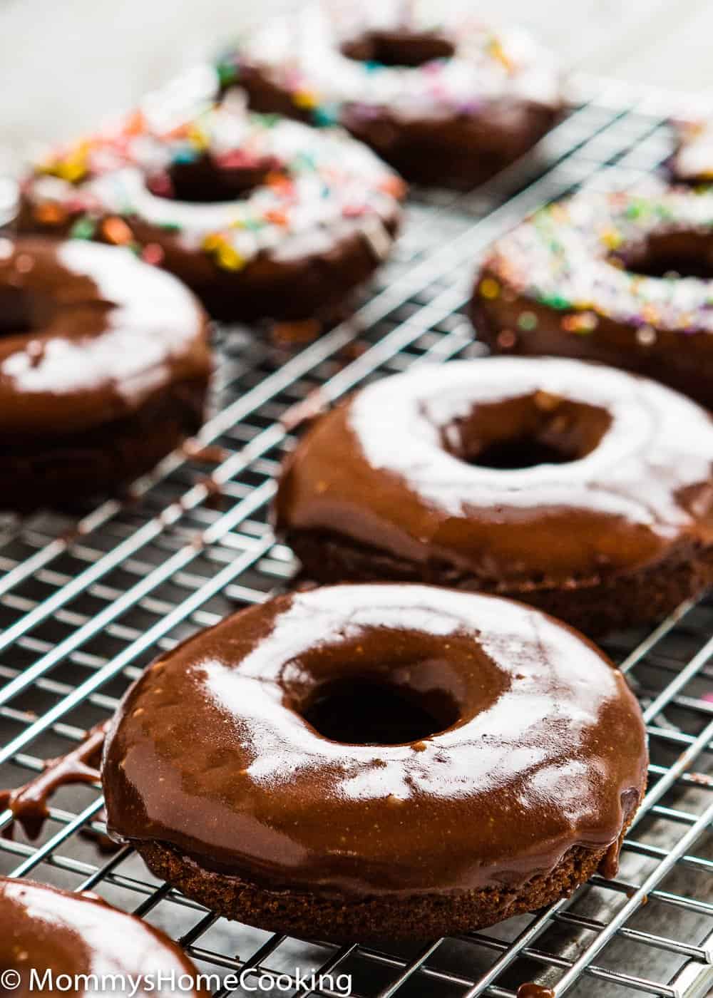 Easy Eggless Chocolate Donuts with chocolate glaze in a cooling rack 