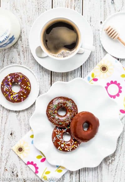 Easy Eggless Chocolate Donuts with chocolate glaze and a cup of coffee