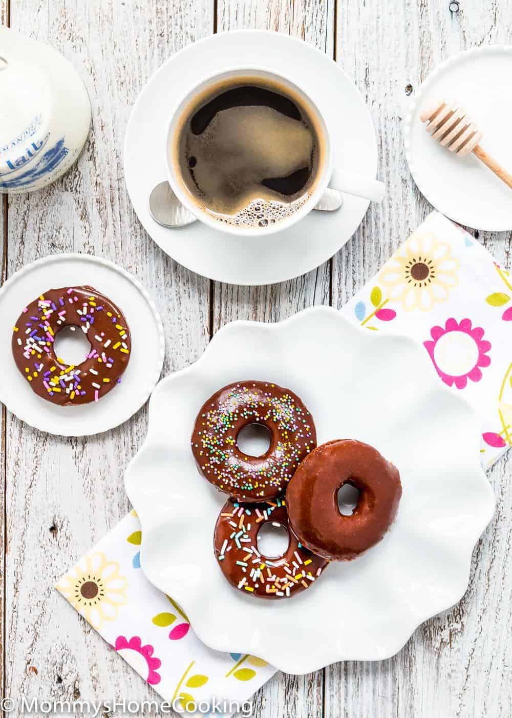 Easy Eggless Chocolate Donuts with chocolate glaze  and a cup of coffee