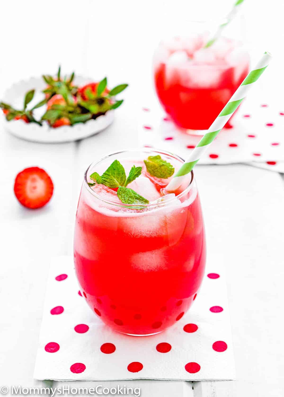 homemade Strawberry lemonade in a glass with a straw 