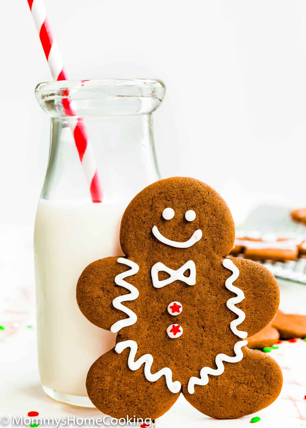 Eggless Gingerbread Cookie with a jar with milk and a red straw