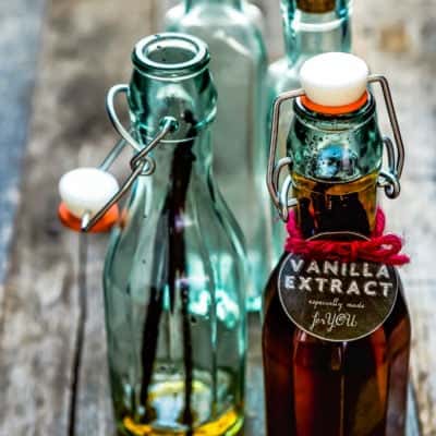 four glass bottle with homemade vanilla extract