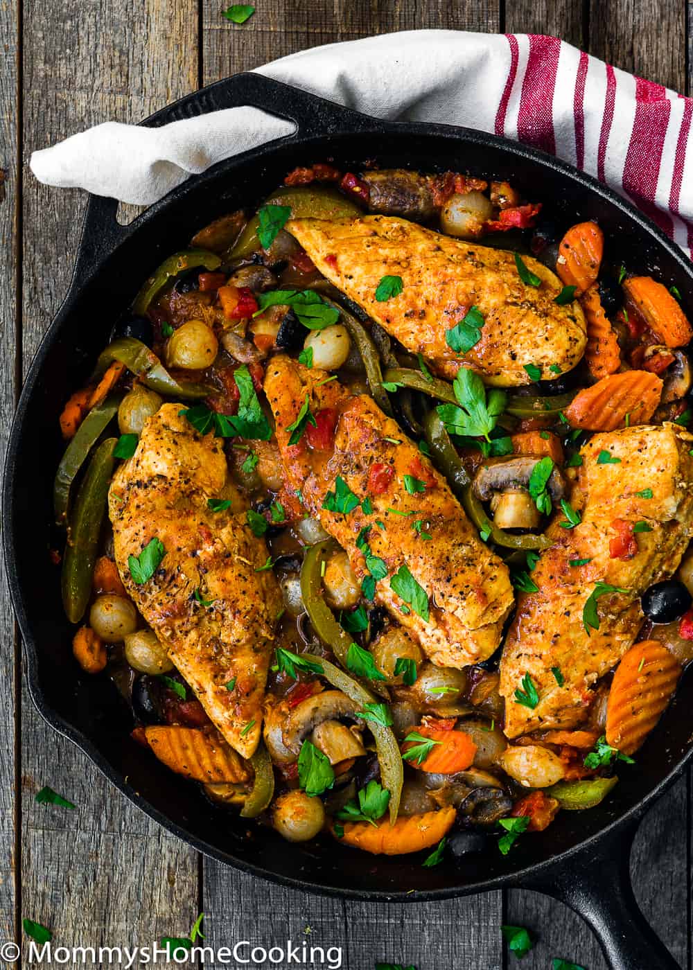 chicken cacciatore with peppers onions mushrooms in cast iron skillet without dredging in flower