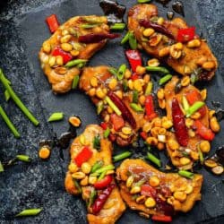 Easy Kung Pao Pork Chops over a black serving plate