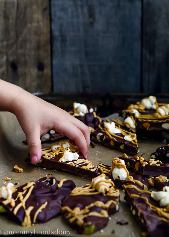 Who can resist this Dulce de Leche Chocolate Bark? Velvety chocolate with nuts, pretzels, and topped with popcorn and dulce de leche chocolate. An award-worthy snack!! https://mommyshomecooking.com