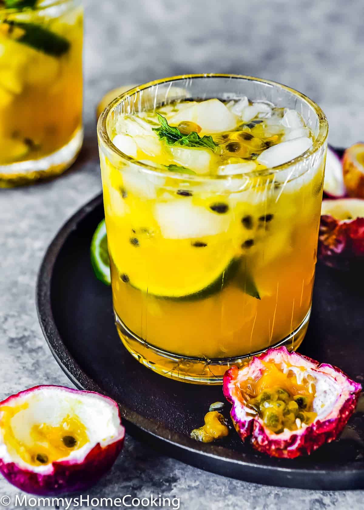 a glass filled with Passion Fruit Caipiroska