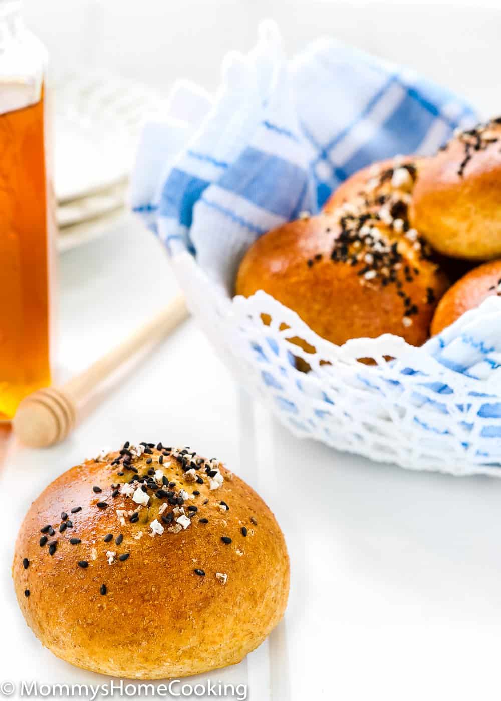 Eggless Honey Whole Wheat Rolls over a white table