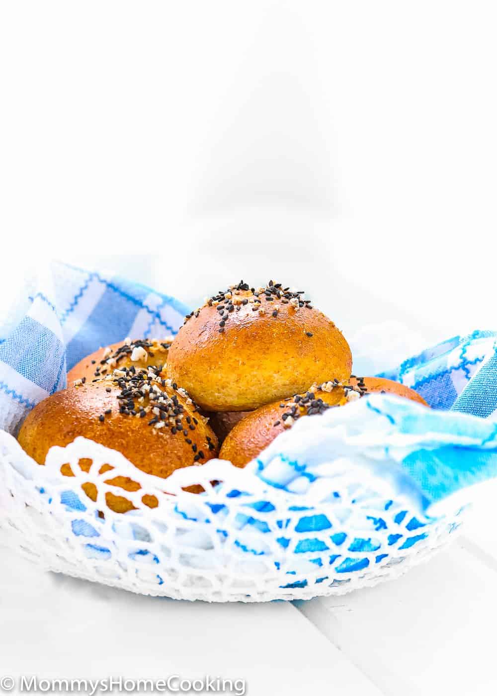 Easy Eggless Honey Whole Wheat Rolls in a bread basket