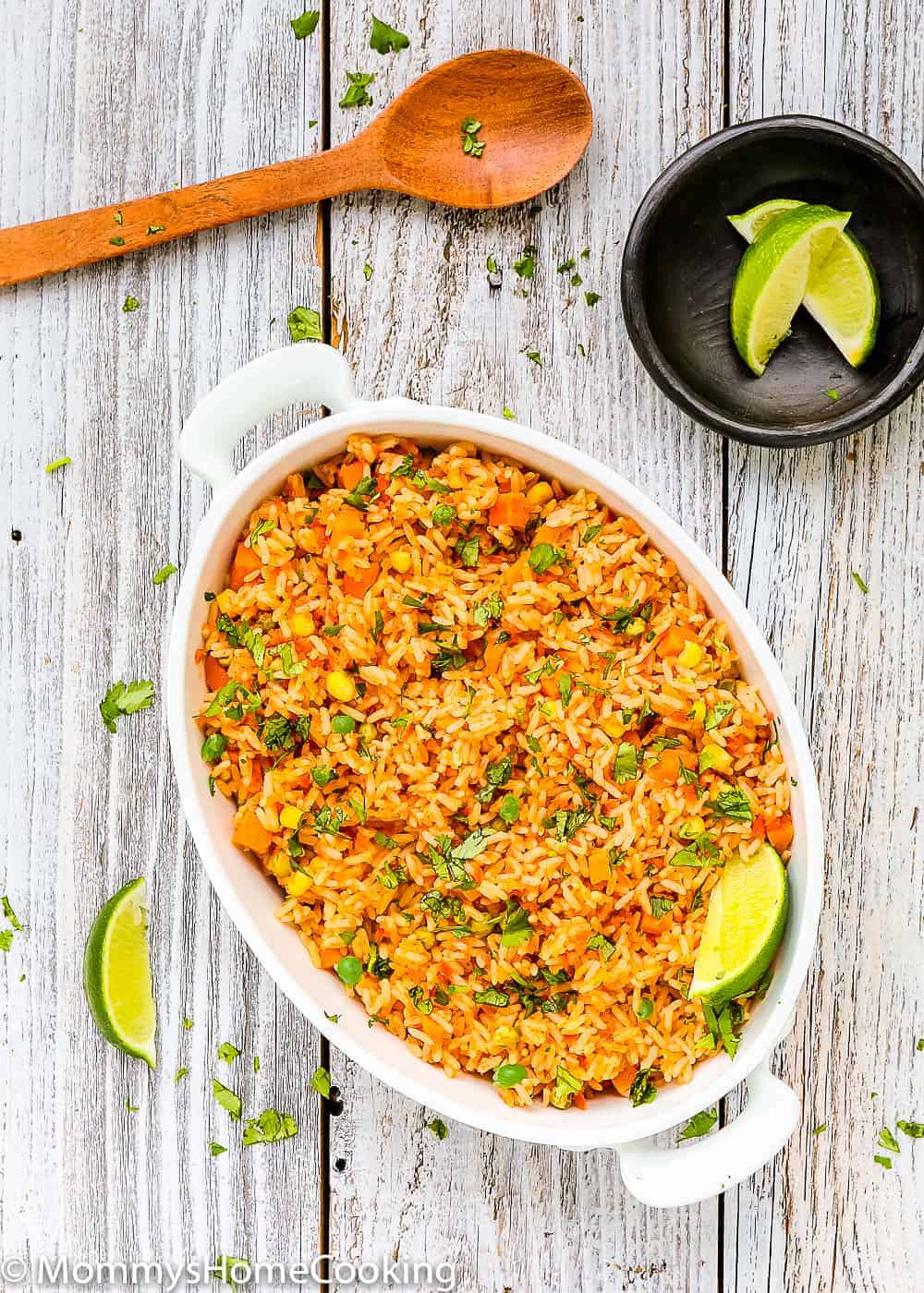 This Easy Mexican Rice is light, fluffy, and flavorful! The best part is that everything gets tossed into the rice cooker, you walk away, and the magic happens in minutes. https://mommyshomecooking.com