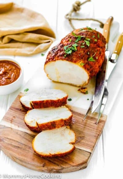 sliced Chipotle Turkey Breast Roast over a cutting board