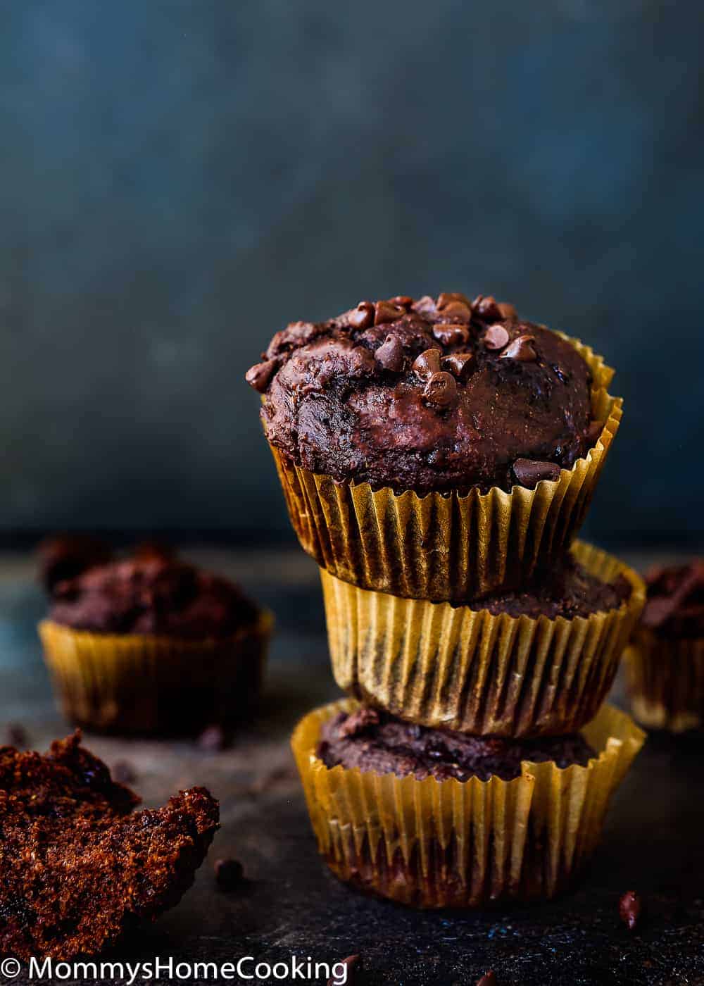 stack of 3 eggless chocolate banana muffins with chocolate chips