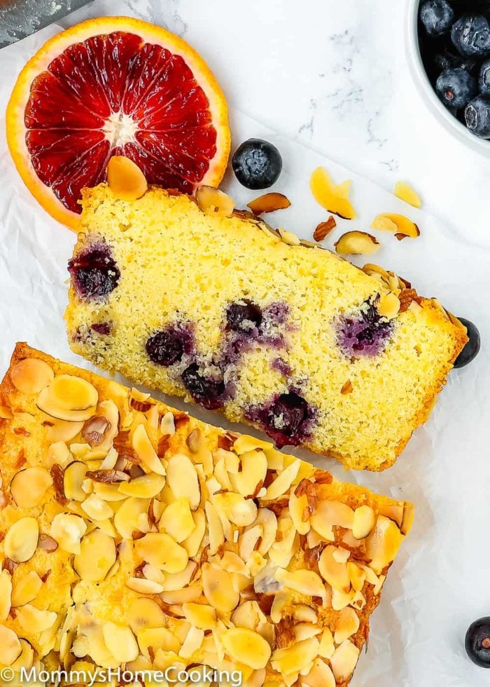 Sweet Eggless Orange Blueberry Corn Bread loaded with blueberries and sprinkled with almonds. The corn-citrus combination is so yummy and perfect for breakfast or snack time. Totally irresistible! https://mommyshomecooking.com