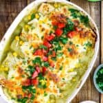 Chicken and Corn Enchiladas with Creamy Green Sauce in a oval baking dish