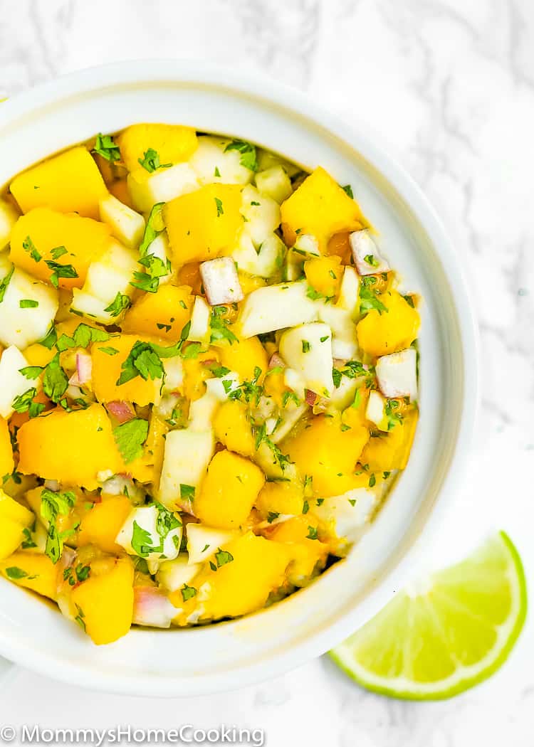 This Fennel Mango Salsa is a crowd pleaser, colorful and full of big flavors! Serve with chips, on tacos or tostadas, or on grilled fish, pork or chicken. https://mommyshomecooking.com