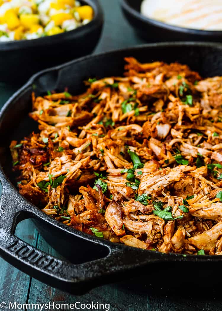 Mexican Pulled Pork in a skillet garnished with cilantro