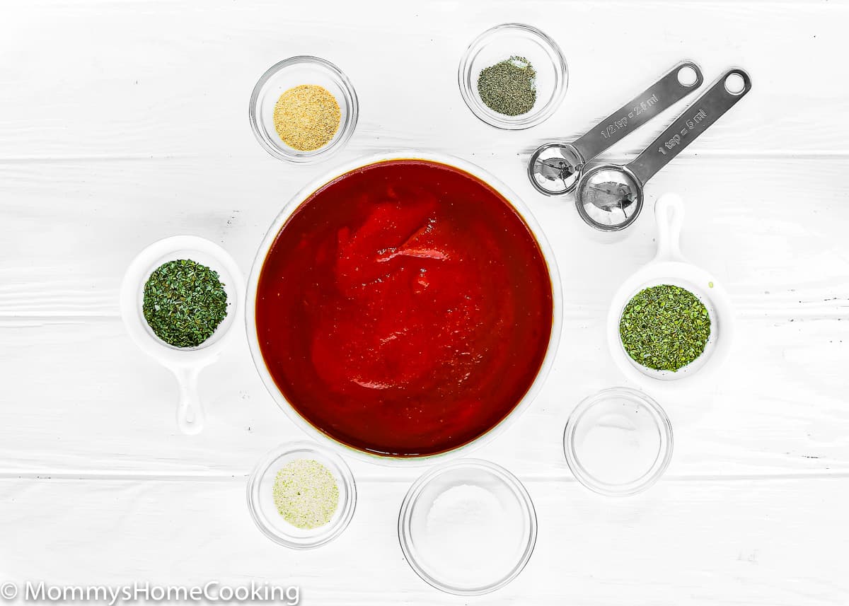 No-Cook Easy Pizza Tomato Sauce Ingredients over a wooden table