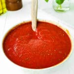 No-Cook Easy Pizza Tomato Sauce in a bowl with a spoon