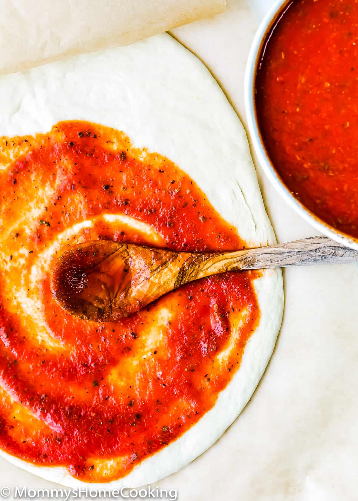 pizza dough with homemade tomato pizza sauce