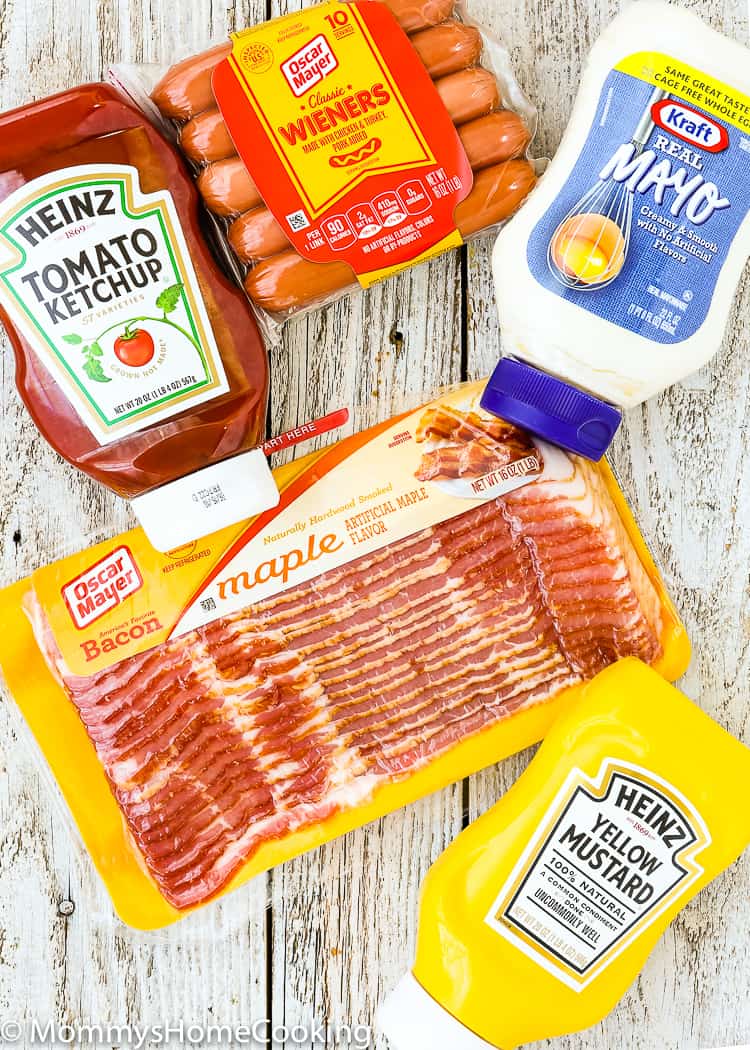 These Easy Bacon-Wrapped Hot Dogs are perfect for a summer weeknight dinner!! Topped with tomato, onion, and jalapeno, this hot dog is a deliciously easy way to say bye-bye to the Ol’ boring bun.
