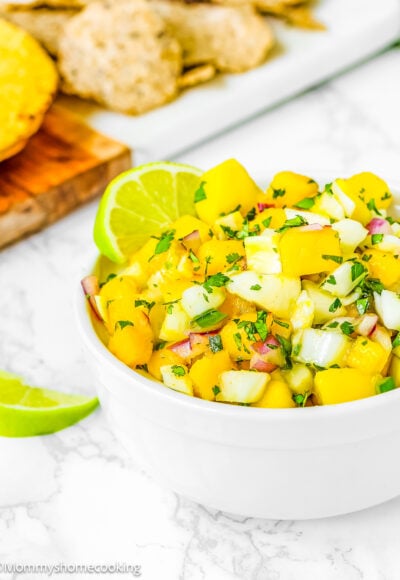 Fennel Mango Salsa in a bowl over amarble surface.