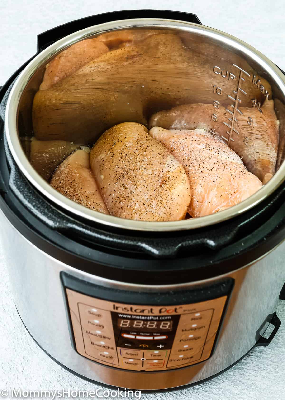 chicken breasts in a pressure cooker pot.