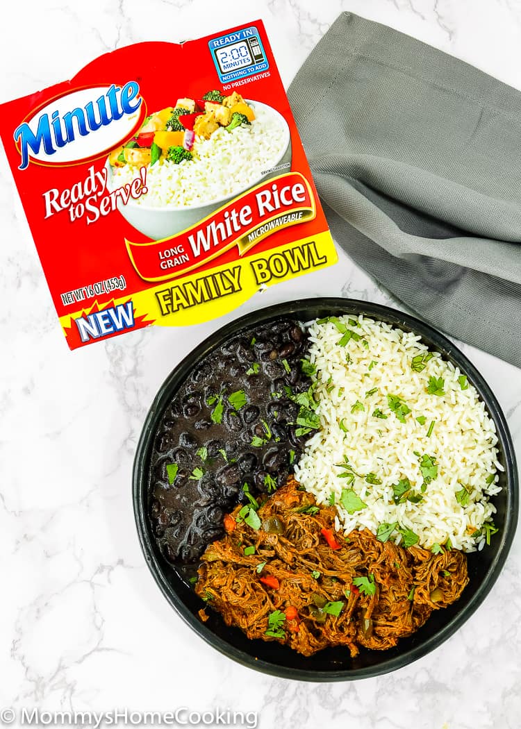 This Venezuelan Pabellon Bowl is meal perfection! Shredded beef, black beans, white rice and fried plantains, make this dish a hearty, filling and most delicious lunch or dinner ever. https://mommyshomecooking.com