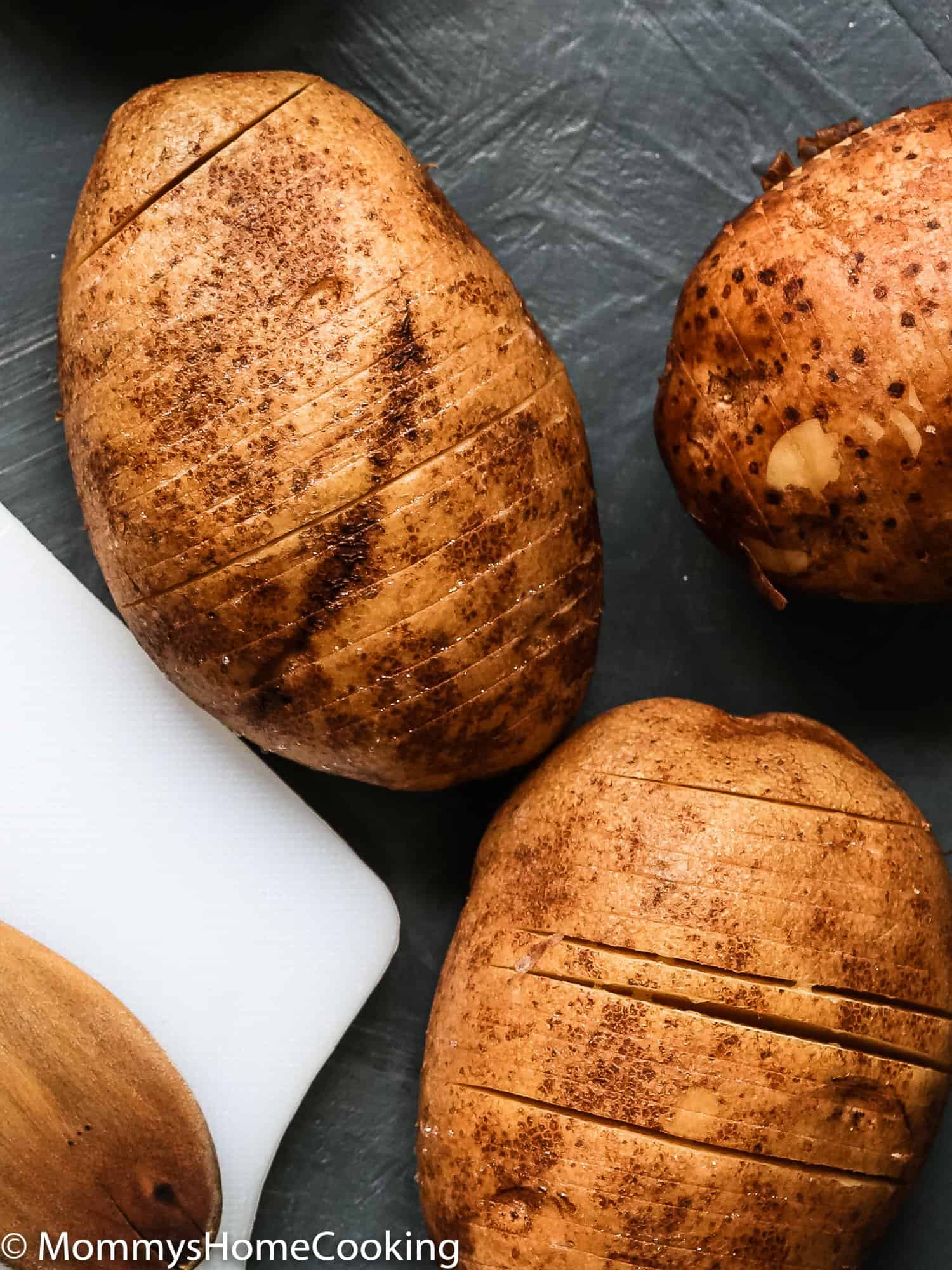 potatoes over a cutting board