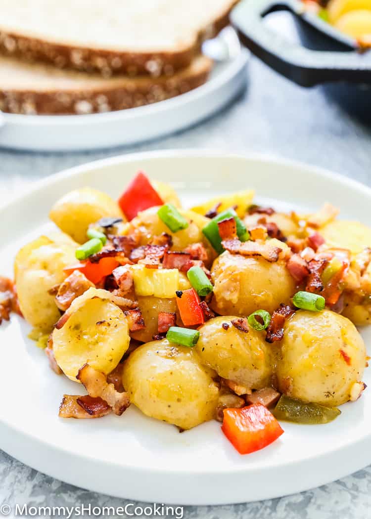 These Slow Cooker Bacon and Ham Breakfast Potatoes are perfect for breakfast, brunch, or breakfast for dinner! This recipe combines everyone’s breakfast favorites – potatoes, bacon, ham, and cheese. https://mommyshomecooking.com