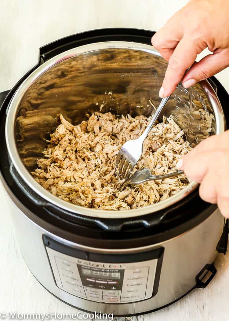 This Instant Pot Cuban Pulled Pork is incredibly flavorful and easy to make. Perfect to make sandwiches, tacos, quesadillas, arepas and more!! https://mommyshomecooking.com