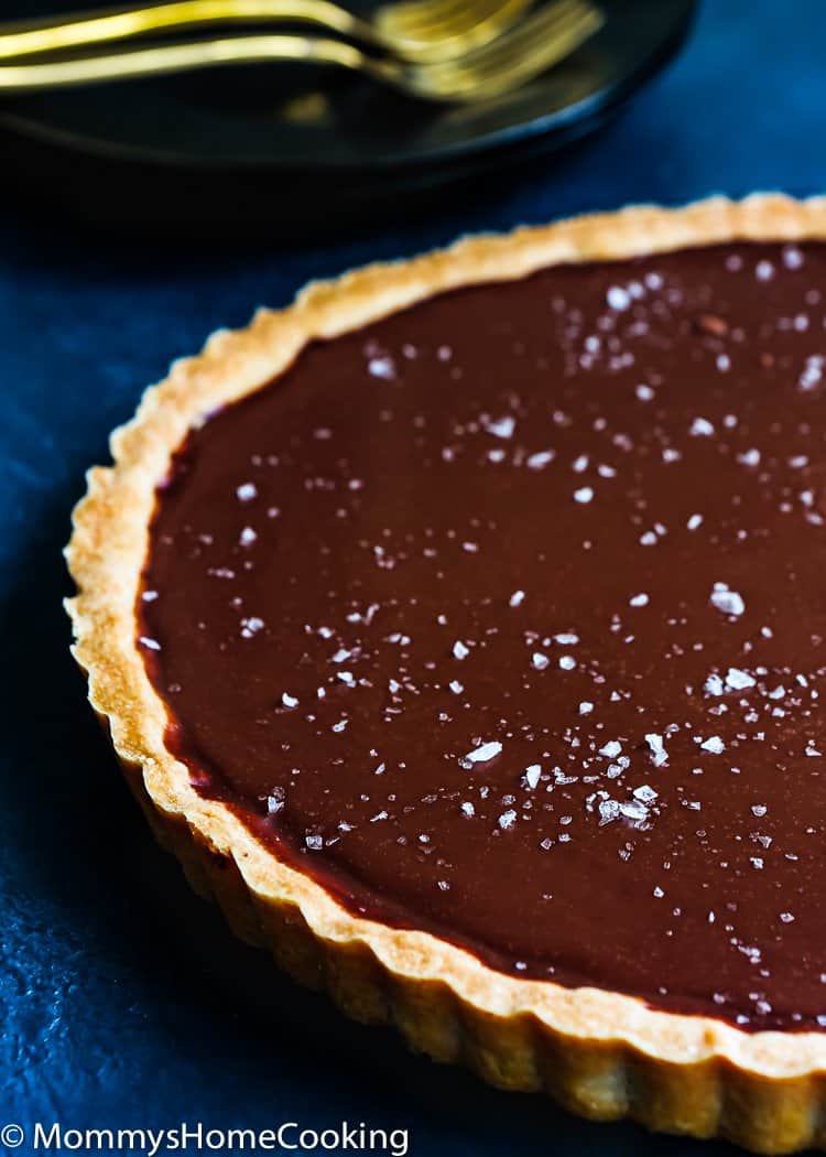This Easy Eggless Chocolate Tart is a ridiculously easy and scrumptious dessert! The flavors of the rich chocolate filling and the buttery flaky crust meld together like no other. You have to taste it for yourself. https://mommyshomecooking.com