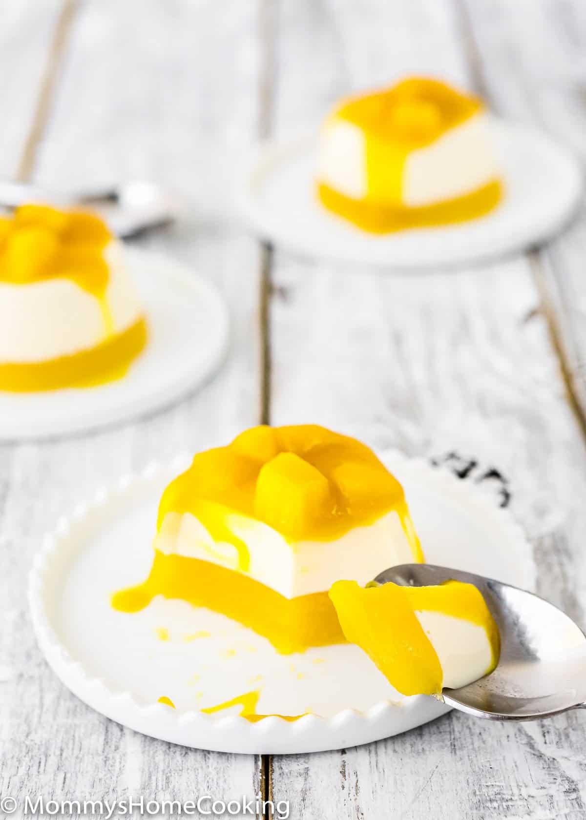 Mango Panna Cotta in a plate with a spoon