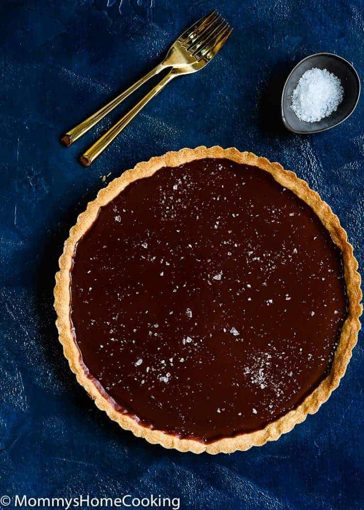 This Easy Eggless Chocolate Tart is a ridiculously easy and scrumptious dessert! The flavors of the rich chocolate filling and the buttery flaky crust meld together like no other. You have to taste it for yourself. https://mommyshomecooking.com