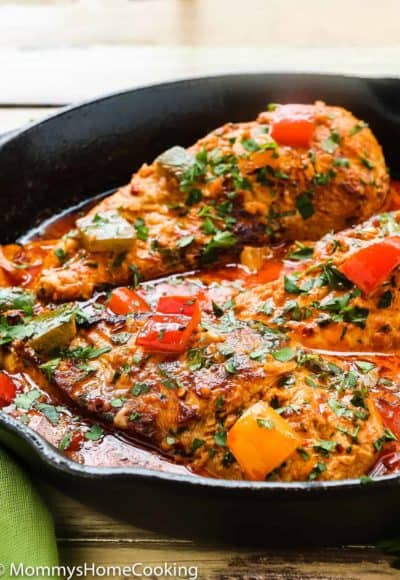 Creamy Peri Peri Chicken in a skillet with sauce and bell peppers.