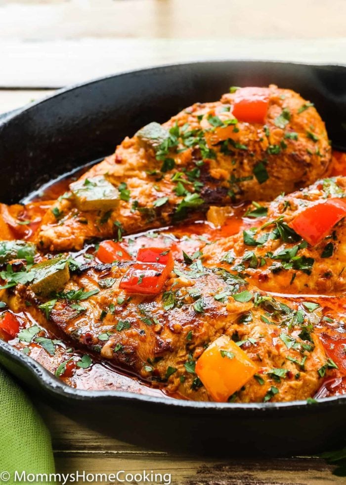 Creamy Peri Peri Chicken in a skillet with sauce and bell peppers.