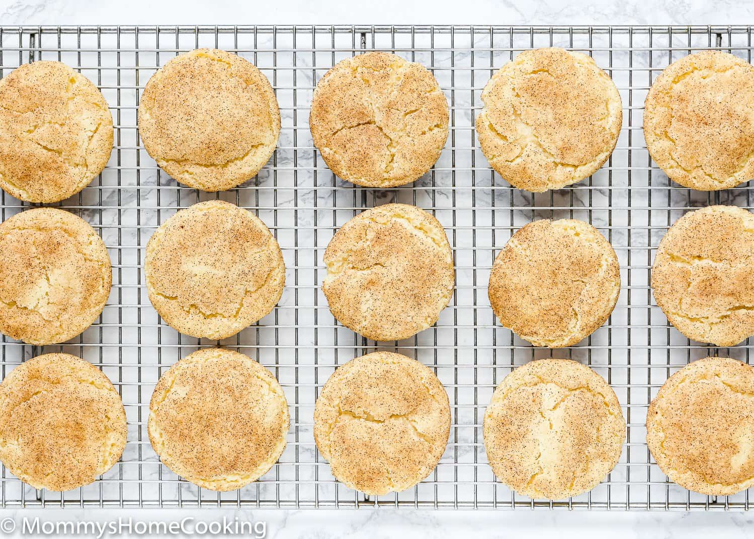 Eggless Snickerdoodle Cookies over a cooling rack.