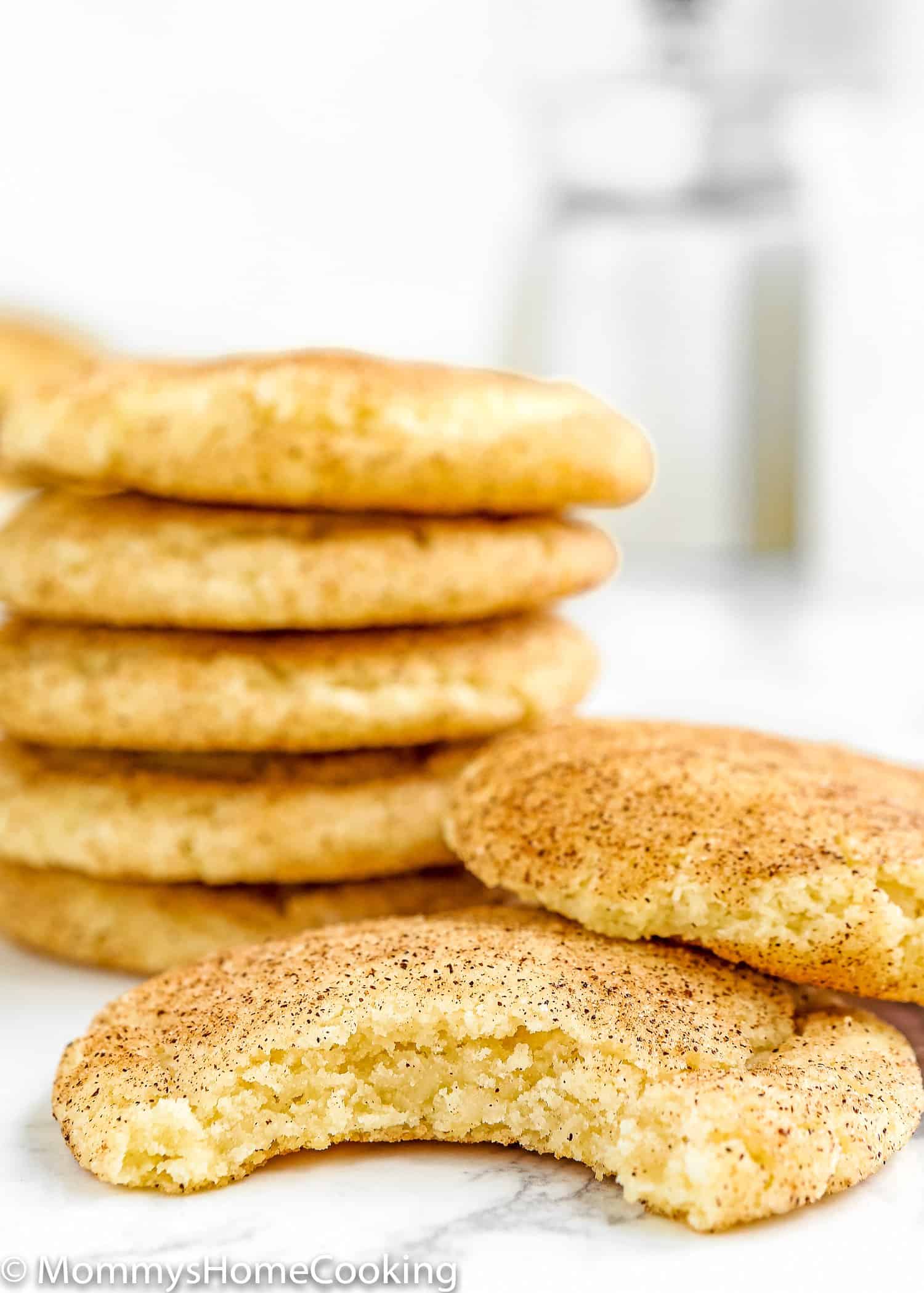 Eggless Snickerdoodle Cookie bitten showing the chewy inside texture