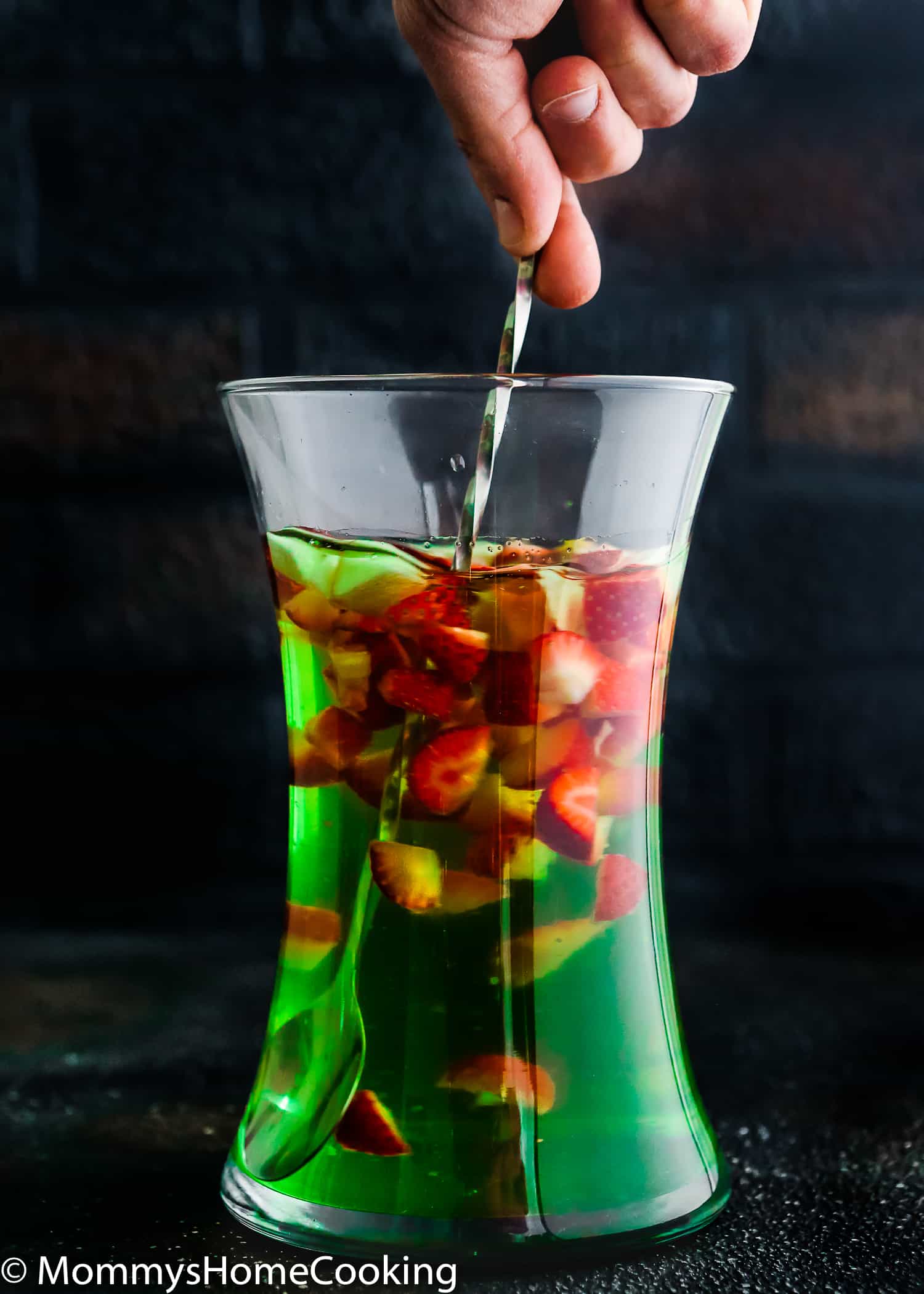 This Green Apple Sangria is boozy, light, crisp and chock-full of yummy fruit. It's the perfect make-ahead cocktail for parties and gatherings. https://mommyshomecooking.com