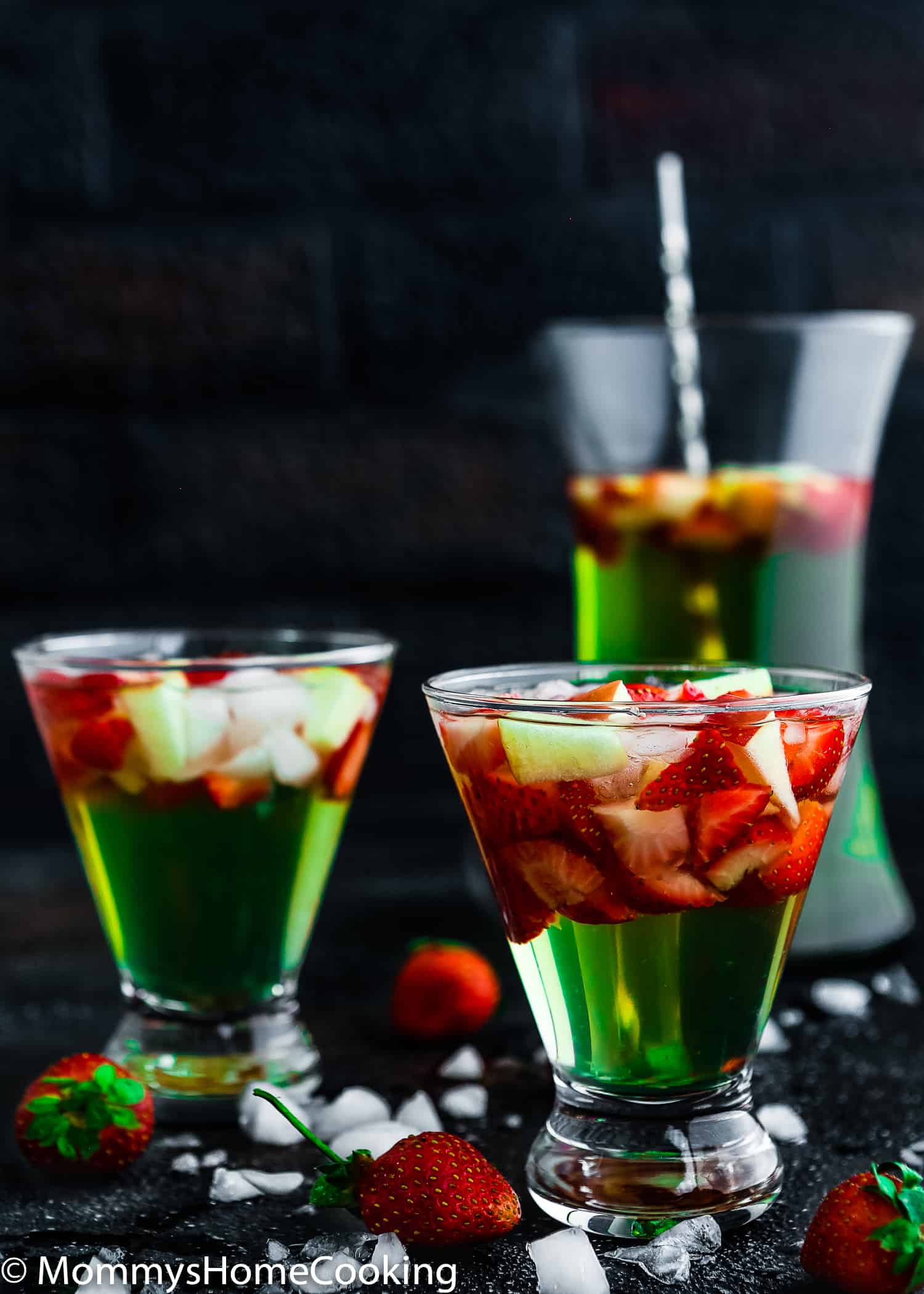 This Green Apple Sangria is boozy, light, crisp and chock-full of yummy fruit. It's the perfect make-ahead cocktail for parties and gatherings. https://mommyshomecooking.com