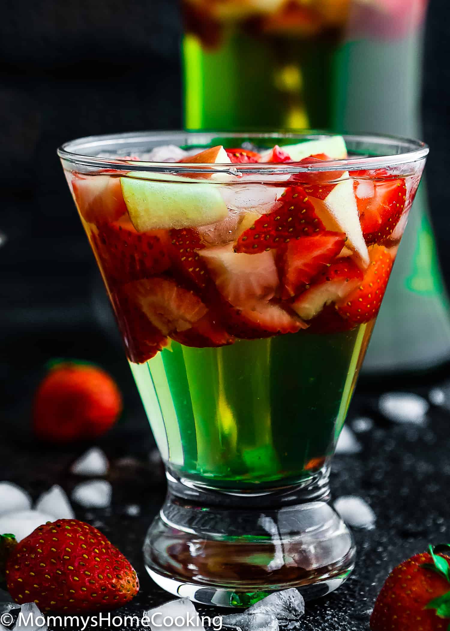 This Green Apple Sangria is boozy, light, crisp and chock-full of yummy fruit. It's the perfect make-ahead cocktail for parties and gatherings. https://mommyshomecooking.com
